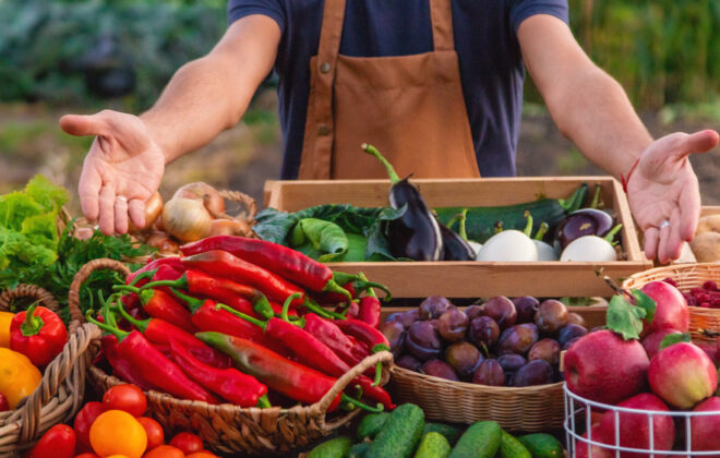 The farmer sells fruits and vegetables at the farmers market. Selective focus. Food.